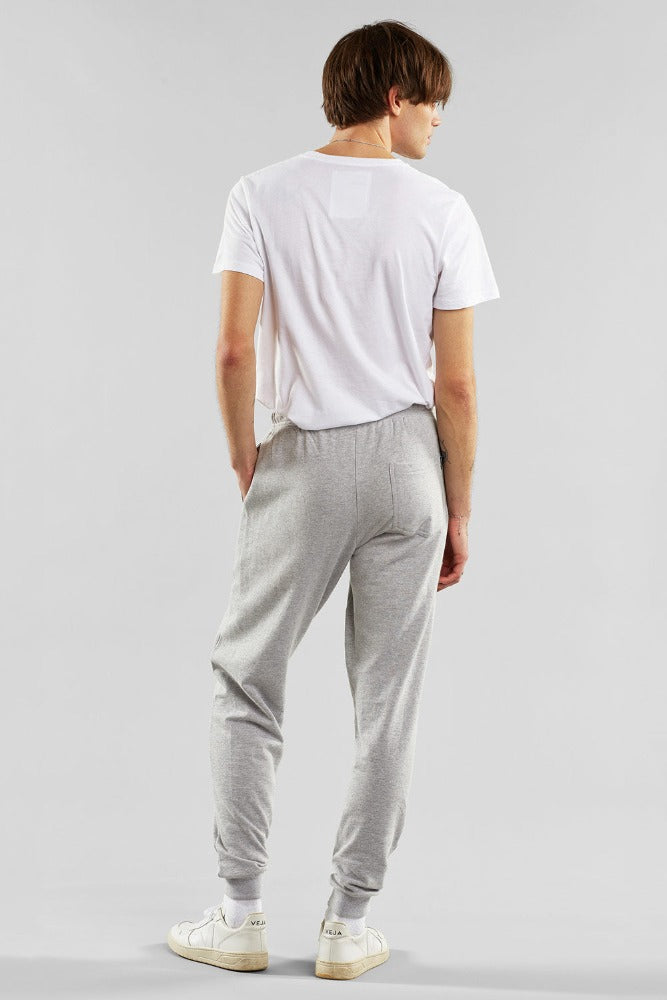 Classic Grey Marl mens joggers by Dedicated with twin pockets and small Dedicated logo on the left leg