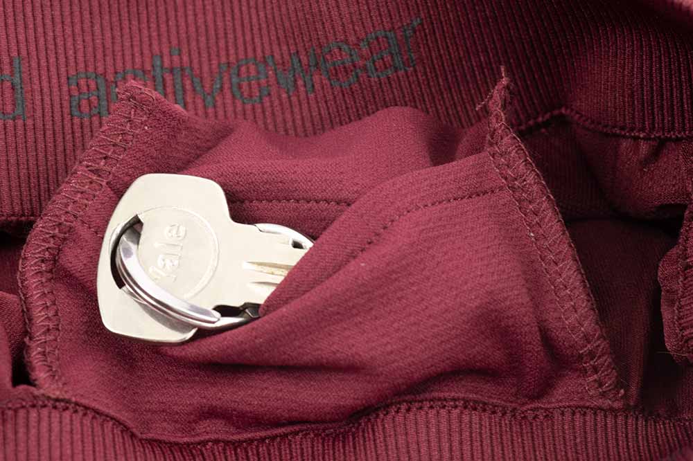 Organic Basics key pocket on burgundy leggings and shorts