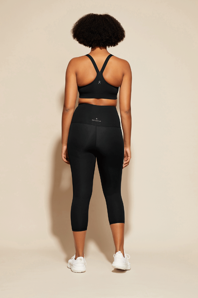 Black essential capri leggings yoga pants by DK Active moisture wicking and muscular support made with 65% recycled materials
